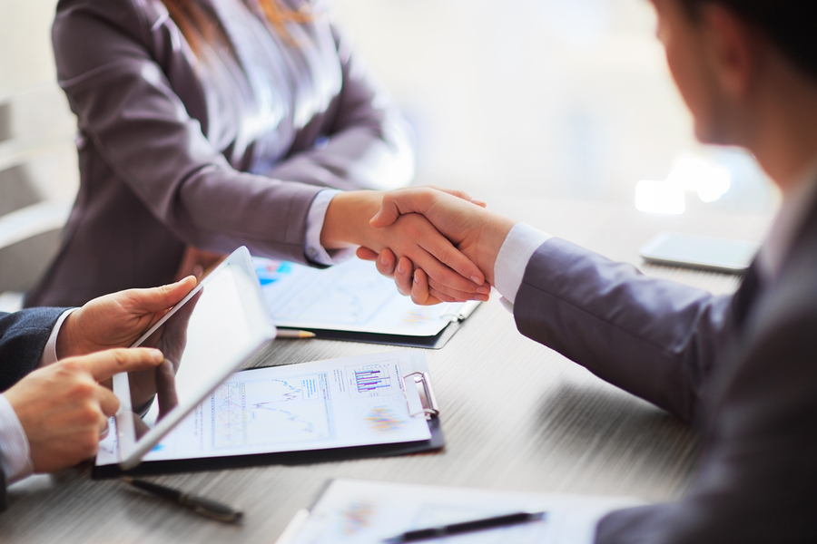 Shaking hands over an agreed lift contract