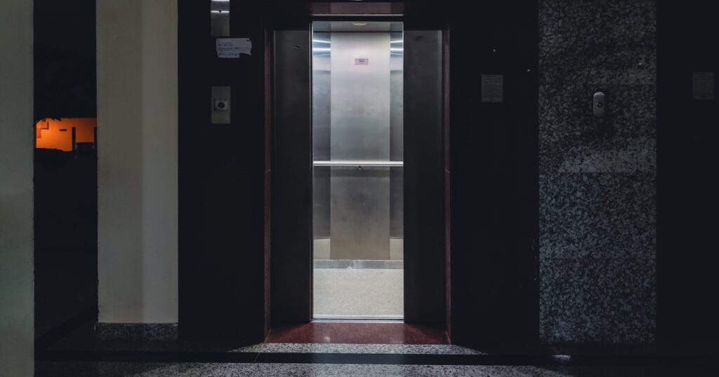 Lift doors open onto a landing inside a building