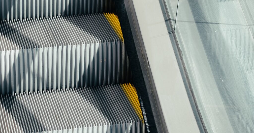 Silver and black escalator